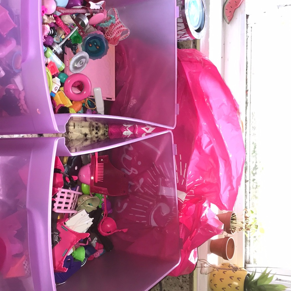 Bins and bags full of doll acssesories